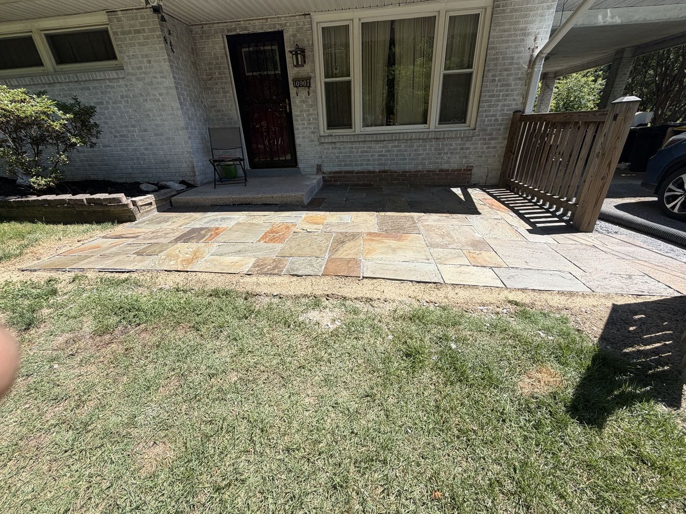 Finished front entry stone patio